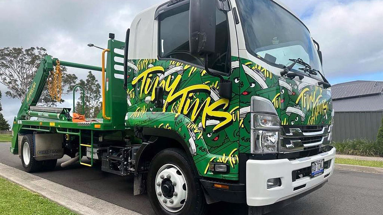 Skip bin being delivered by a truck